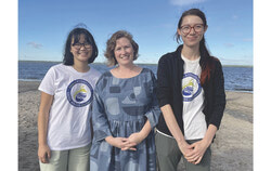 Laura Reinsborough, CEO Riverkeeper, stands with Elizabeth Lacroix, Water Quality Assistant, to her right and Hannah Delion, River School Assistant, to her left, at this year’s Riverkeeper Open Water Swim on August 13, 2023. “As an organization, we exist to protect and promote the ecological health of the Ottawa River watershed. The Riverkeeper Open Water Swim is an extension of this, and we are so excited that this year we were able to return to an interprovincial race. (In 2020, COVID-19 restrictions had limited the swim to the Ontario side.) It cannot be stressed enough how important it is that decision makers from both sides work collaboratively toward the best interests of this shared border so that it remains drinkable, fishable and swimmable,” said Reinsborough. Photo: Alana Repstock
