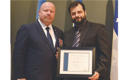 From left to right, Ian Lafrenière, Deputy Premier, Minister of Internal Security, and Minister responsible for Relations with First Nations and Inuit, with Christian Belzil-Lacasse, who received a Citation of Honour. Photo: Daniel Jalbert