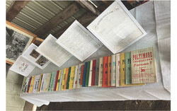 Decades of fair programs, including a 1968 edition advertising horse drawing, children's races and livestock judging, are laid out with framed schedules and correspondence from the club's archives. Photo: Courtesy