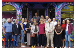 Members and partners of the Outaouais roundtable on hunger and social development gathered outside Le Marché de l'Outaouais. The roundtable's new guide helps Gatineau seniors eat well on a fixed income and find food aid in Aylmer, Hull, Gatineau and Buckingham. Photo: Courtesy of TCFDSO