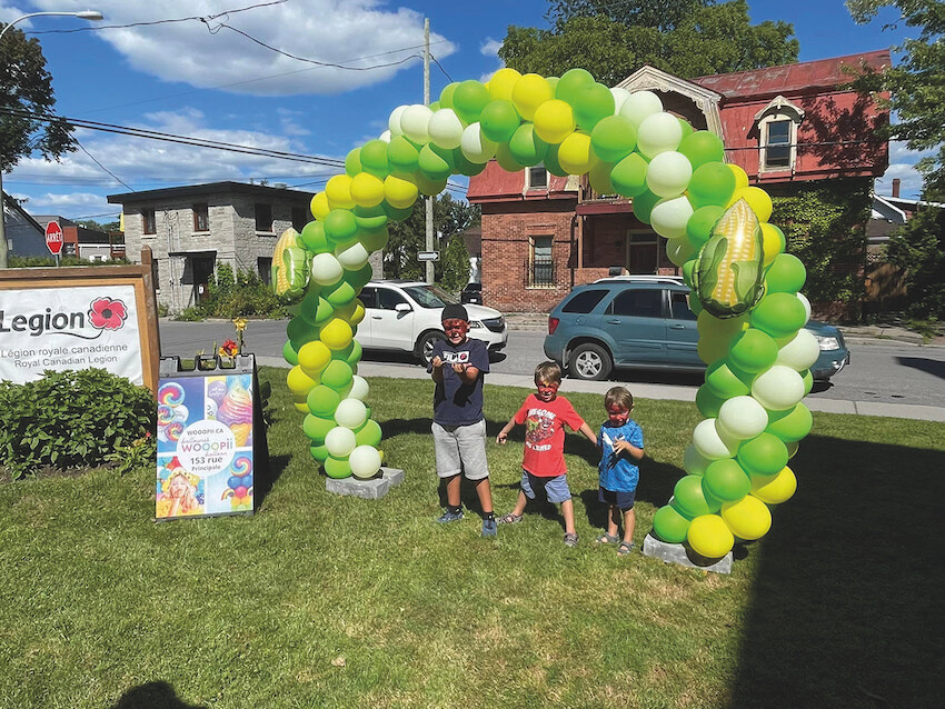 Children enjoying the day at the Aylmer Legion (balloon arch from Wooopii Balloons). Photo credit: Aylmer Legion.